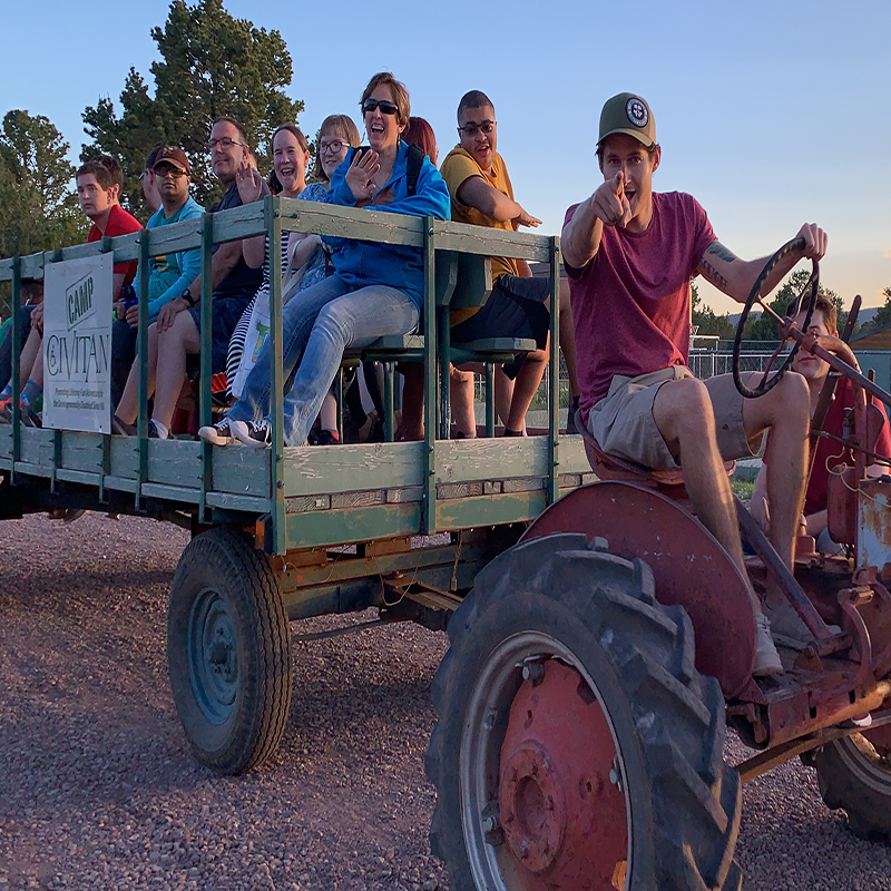 Campers enjoying a tractor ride at Camp.